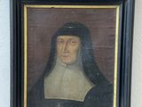 portrait of a man in a black and white robe with a black hat