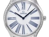 a close up of a watch with roman numerals on the face
