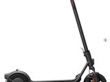 an image of a black scooter on a white background