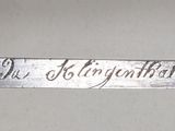 a close up of a knife that is on a table