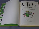an open book with a picture of a dog and a cat on it