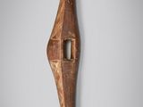 a close up of a wooden object on a wall