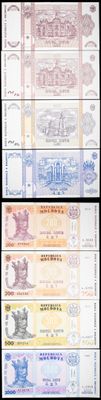 four different types of currency are shown on a black background