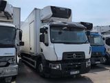 many trucks that are parked in a parking lot