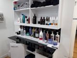 many different types of hair care products on the shelves