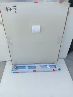 an open refrigerator sitting on top of a white counter top