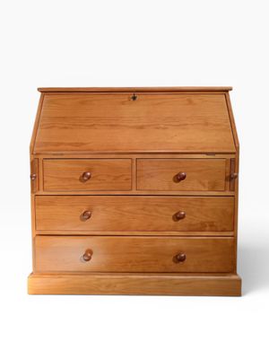 a wooden desk with drawers and drawers on top of it
