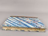 an image of a blue and white book with flowers on it