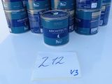 a group of cans of blue paint sitting on top of a white table