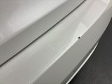 a close up of a car ' s front bumper
