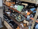 a room with a lot of electronics on the shelves