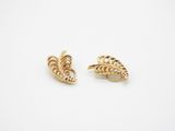a pair of gold earrings with a leaf design