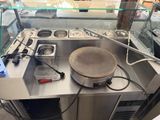 stainless steel counter top with a frying pan on top of it