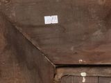 an old wooden box with a sticker on it