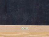 a picture of a blackboard on the wall of a building