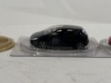 a black car and a red car on a clear plate