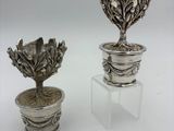 pair of antique silverplated flower pots on acrylic stand