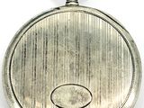 an old silver pocket watch with a chain on a white background