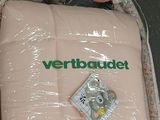 a baby bed in a plastic bag with a stuffed animal in it