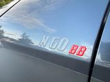 a close up of a car ' s number on the side of the car