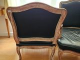 two chairs sitting next to each other in a room