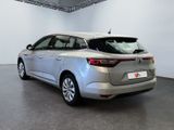 a picture of a silver car in a showroom