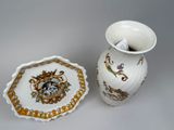 two vases and a plate on the table