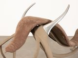 a chair that has horns on the back of it