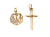 un pendentif en or orné d'une croix et d'une balance