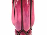 a pink vase sitting on a metal stand on a white background