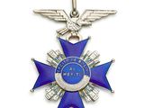 une image représentant une médaille bleue et argentée ornée d'un aigle