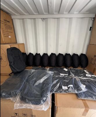 many bags of luggage in the back of a moving truck