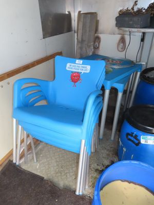 a blue chair and a blue table in a room