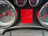 a close up of a car dashboard with various gauges and numbers