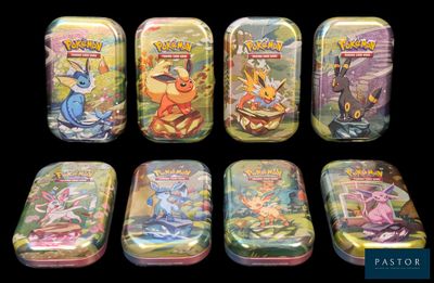 pokemon tins are lined up in a row on a black background