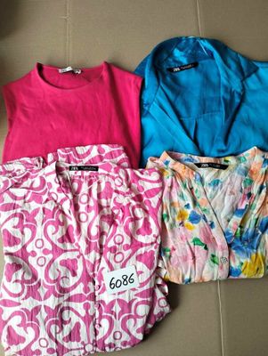 three women ' s pajamas are lined up on a tile floor