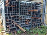 a pile of steel bars stacked on top of each other