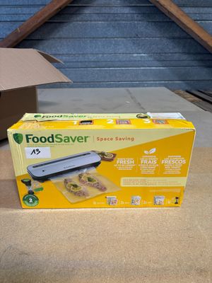 a box of food sitting on the floor next to a box of food