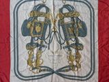 an image of a red and blue scarf with two lions on it