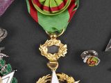 several medals are displayed on a black surface with a black background