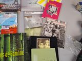 a table with many books on it and a teddy bear