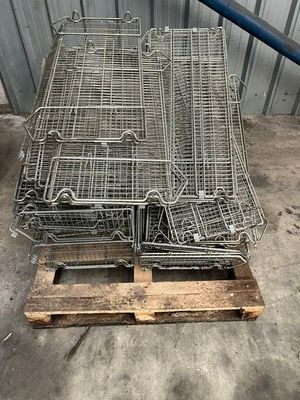 two cages that are sitting on top of a pallet