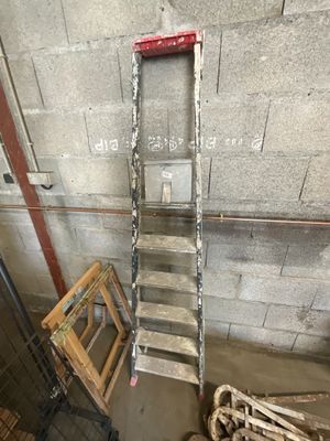 a ladder leaning up against a wall in a room