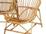 pair of rattan chairs on white background with white background