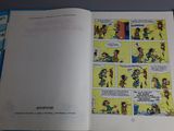 a comic book open on a table with a comic strip