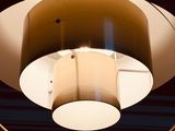 a light that is hanging from a ceiling in a dark room