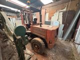 a tractor that is parked inside of a building