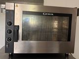 an image of a stainless steel oven sitting on a counter