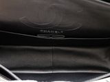 a chanel bag that is sitting on top of a table