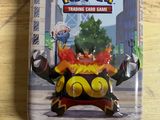 pokemon trading card game in a tin on a wooden table